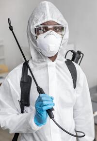 person disinfecting restricted area 2